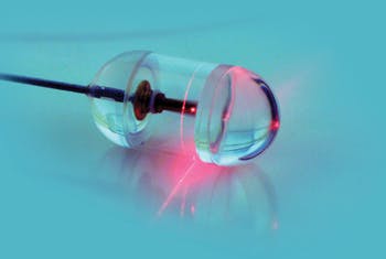 This one-inch endomicroscopy capsule, tethered to a console by optical fiber, contains a rotating infrared laser tip along with sensors that record reflected light.