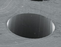 A 200-micron-diameter hole in 0.7-thick-silicon using a picosecond laser with a wavelength of 355 nm.