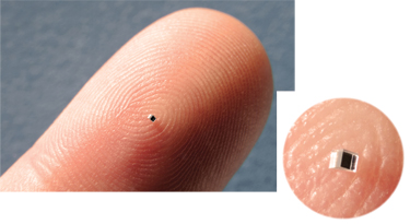 Submillimeter optics can be so small (inset) as to be mistaken for a spec of dirt on your finger.