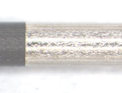 FIGURE 3. Small-gage wire stripped by a 355nm UV laser. FIGURE 3. Small-gage wire stripped by a 355nm UV laser.