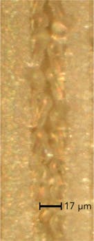 FIGURE 4. Top-view microscope picture showing clean quality laser scribe using 80 J/cm2 fluence at 200 kHz PRF. FIGURE 4. Top-view microscope picture showing clean quality laser scribe using 80 J/cm2 fluence at 200 kHz PRF.