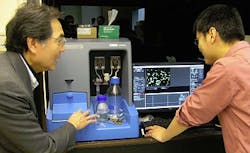 Professor Tuan Vo-Dinh discusses results from his NanoSight NS500 with Dr. Hsiangkuo Yuan from his research group. Professor Tuan Vo-Dinh discusses results from his NanoSight NS500 with Dr. Hsiangkuo Yuan from his research group.