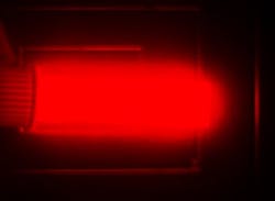 Bright light emission from silicon quantum dots in a cuvette. The image is from a camera that captures the near-infrared (NIR) light that the quantum dots emit. The light emission shown is a pseudo-color, as NIR light does not fall in the visible spectrum. Bright light emission from silicon quantum dots in a cuvette. The image is from a camera that captures the near-infrared (NIR) light that the quantum dots emit. The light emission shown is a pseudo-color, as NIR light does not fall in the visible spectrum.