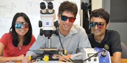 Cindy Wong, Adam Harrison, and Dileepan Joseph (left to right) model the red/cyan glasses used to view 3D images from their VLRM.