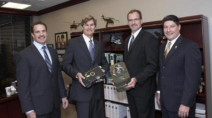 Dr. Timothy Day, chairman and CEO of Daylight Solutions, Paul Larson, president, COO, Daylight Solutions, Carl Smith, VP of infrared countermeasures for Northrop Grumman, and Jeffrey Palombo, VP and GM of Northrop Grumman's Land and Self Protection Systems Division, unveil the companies' CIRCM laser and pointer-tracker offering.