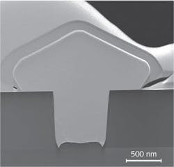 A transmission electron microscopy (TEM) cross-section reveals a selective-area epitaxially overgrown germanium (Ge) structure before chemical-mechanical polishing (CMP); the bottom-up fabrication process for this photodiode enables a low dislocation-defect density. A transmission electron microscopy (TEM) cross-section reveals a selective-area epitaxially overgrown germanium (Ge) structure before chemical-mechanical polishing (CMP); the bottom-up fabrication process for this photodiode enables a low dislocation-defect density.