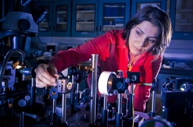 UCSD postdoctoral researcher Mercedeh Khajavikhan is at work in the optics laboratory.