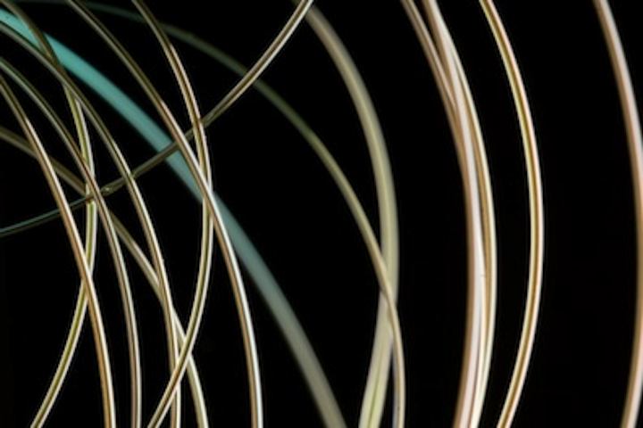 Radially emitting fiber laser emits light at a controlled location