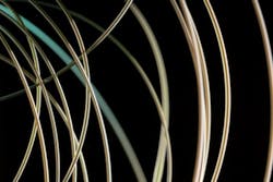 A new fiber developed at MIT emits blue laser light only at a precisely controlled location. A new fiber developed at MIT emits blue laser light only at a precisely controlled location.