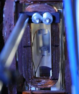 JILA's superradiant laser traps about a million rubidium dipoles in a space of about 2 cm between two mirrors. The atoms synchronize their internal oscillations to emit laser light.