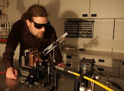 Bernd Heinen works on a semiconductor disk laser jointly developed by Marburg, Germany and Tucson, AZ researchers that achieved a record 100 W output Bernd Heinen works on a semiconductor disk laser jointly developed by Marburg, Germany and Tucson, AZ researchers that achieved a record 100 W output