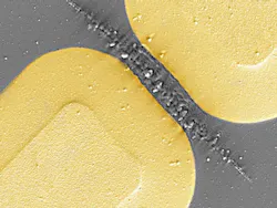 A scanning-electron micrograph shows damaged vanadium dioxide in the gap of a terahertz metamaterial made of gold. The damage results when strong field enhancement of incident terahertz radiation in the gaps leads to a rapid increase in the energy density following the field-driven insulator-to-metal transition.
