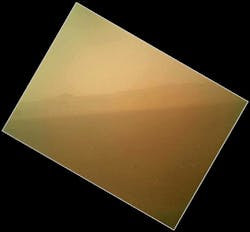 The landscape is shown to the north of NASA&apos;s Mars rover Curiosity in this first image acquired by the Mars Hand Lens Imager (MAHLI), revealing the north wall and rim of Gale Crater. The image is murky because the MAHLI&rsquo;s removable dust cover is apparently coated with dust blown onto the camera during the rover&apos;s terminal descent. The dust cover will be removed in the coming weeks.