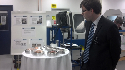 Martin Konk of Trumpf Photonics shows off some of the photonics used in Trumpf's laser-diode pump modules, including resonator and beam-guidance mirrors and beam-shaping optics. The components are all manufactured at the Trumpf Photonics site in Cranbury, NJ.