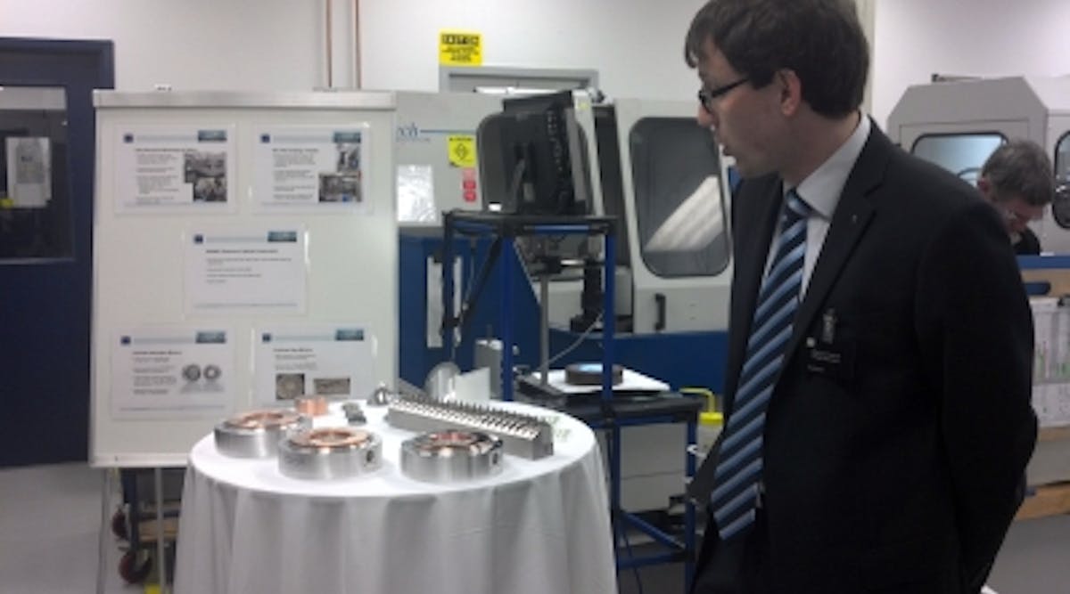 Martin Konk of Trumpf Photonics shows off some of the photonics used in Trumpf&apos;s laser-diode pump modules, including resonator and beam-guidance mirrors and beam-shaping optics. The components are all manufactured at the Trumpf Photonics site in Cranbury, NJ.