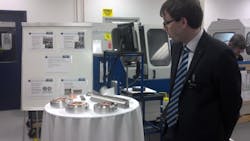 Martin Konk of Trumpf Photonics shows off some of the photonics used in Trumpf&apos;s laser-diode pump modules, including resonator and beam-guidance mirrors and beam-shaping optics. The components are all manufactured at the Trumpf Photonics site in Cranbury, NJ.