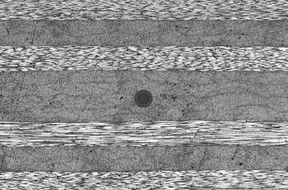An ultrathin 80 micron diameter fiber with embedded fiber Bragg grating (FBG) sensors is easy to incorporate into composites or smart textiles due to its improved flexibility and small form factor.