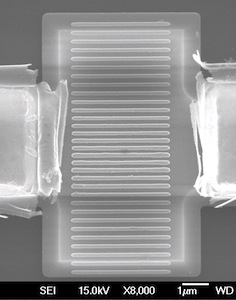 Crystalline silicon sits between two electrodes in a microscopic antenna-on-a-chip designed by researchers at Rice University. The chip, a spatial light modulator, couples with incident light and makes possible the manipulation of IR light at very high speeds for signal processing and other optical applications.