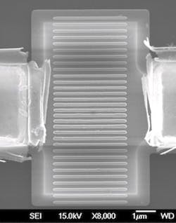 Crystalline silicon sits between two electrodes in a microscopic antenna-on-a-chip designed by researchers at Rice University. The chip, a spatial light modulator, couples with incident light and makes possible the manipulation of IR light at very high speeds for signal processing and other optical applications.