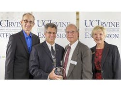 UC Irvine has honored Donn Silberman (holding award) with the Dean&apos;s Outstanding Service Award for his work at UC Irvine Extension as a founding advisory committee member of the Optical Engineering and Optical Instrument Design certificate programs. (Courtesy OC Register)