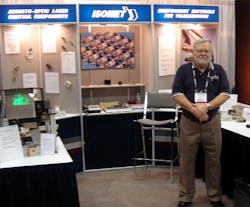 Acousto-optic device company Isomet mourns loss of VP of sales Everett Taylor, shown here at a photonics industry conference. (Courtesy Isomet)