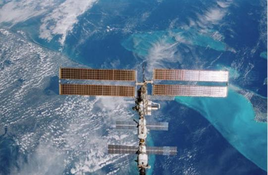 Russian astronauts aboard the International Space Station have used its laser to beam data back to Earth.