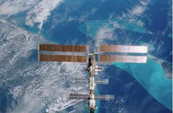 Russian astronauts aboard the International Space Station have used its laser to beam data back to Earth.