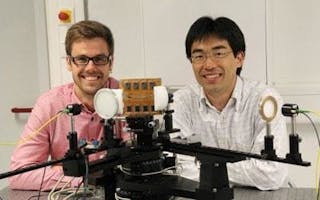 Yasuaki Monnai (right) and Kristian Altmann have created a terahertz beam-steering and focusing device, shown mounted to the characterization setup at Marburg University. (Courtesy Bastian Reitemeier, University of Marburg)