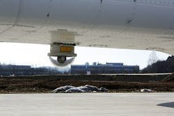 The mobile telescope on the aircraft automatically tracks the position of the ground-based receiver. The incoming and outgoing light signals are directed through a tunnel in the base of the aircraft. The mobile telescope on the aircraft automatically tracks the position of the ground-based receiver. The incoming and outgoing light signals are directed through a tunnel in the base of the aircraft.