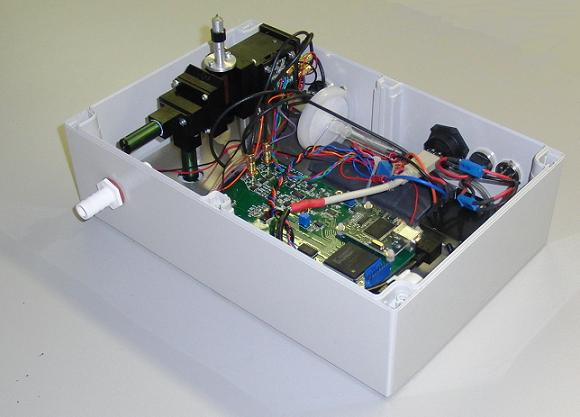 The prototype asbestos detector unit is shown with the lid removed. The prototypes are now undergoing field trials at various locations where asbestos removal operations are underway. (Image credit: Paul Kaye, University of Hertfordshire)