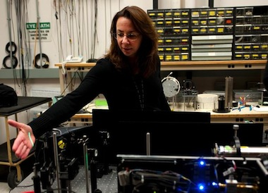 NAWCAD engineer Linda Mullen demonstrates a laser used in underwater optics. Mullen patented a new encoding method for laser imaging, which offers possibilities for both fleet and commercial use.