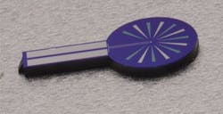 The NIST TES package contains a 25-µm-square sensor at the center of its circular section. The NIST TES package contains a 25-µm-square sensor at the center of its circular section.