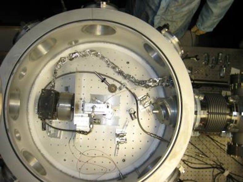 In the vacuum chamber in which the acceleration occurs, the petawatt laser beam arrives from the right. The gas cell is in the center of the chamber. The actual acceleration occurs over a distance of about an inch within the gas cell.