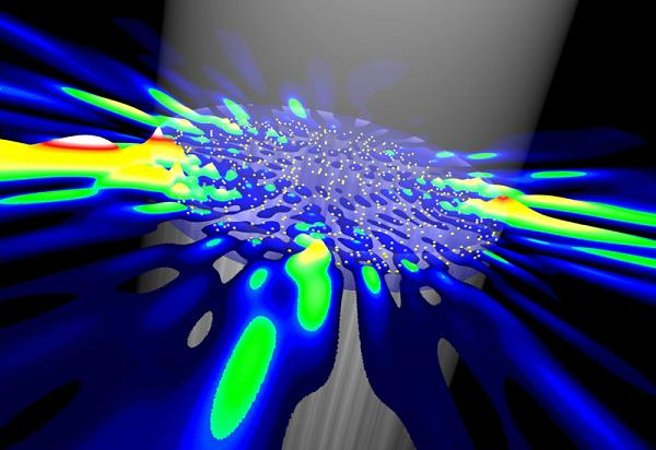 Random lasers are powered by a beam of light from above. Random scatterers inside the laser (yellow dots) lead to chaotic emission of light into all directions.