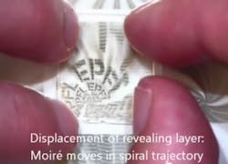 In order to thwart forgeries, EPFL researchers propose a new miniaturized authentication system. By combining both moiré patterns and microlithography techniques, it can be easily recognized by the naked eye and impossible to reproduce through currently existing printer or scanner technology. In order to thwart forgeries, EPFL researchers propose a new miniaturized authentication system. By combining both moiré patterns and microlithography techniques, it can be easily recognized by the naked eye and impossible to reproduce through currently existing printer or scanner technology.