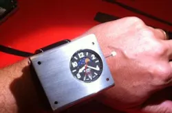 A prototype cesium-133 atomic optical wristwatch is 60 x 50 x 23 mm in size -- a bit large; the production model should be smaller.