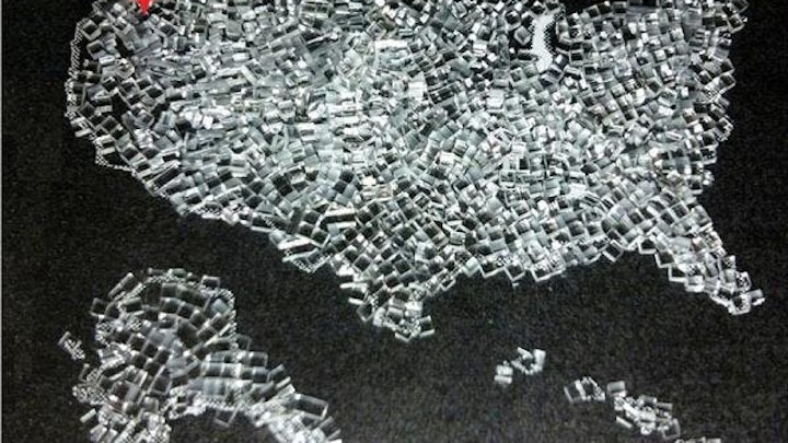 Strengthened Gorilla glass cut into 1 mm cubes using FiLaser's patented glass process is arranged in the shape of the US, with FiLaser's headquarters in Portland, OR indicated in red.