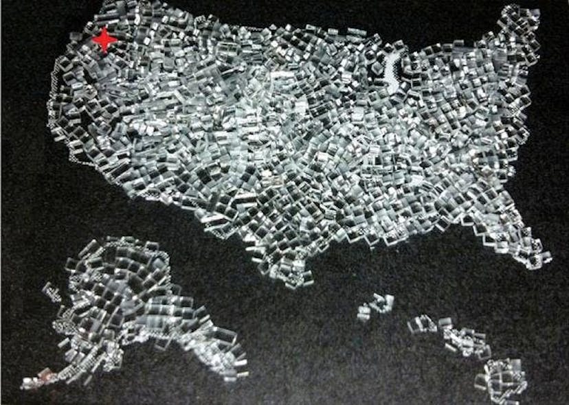 Strengthened Gorilla glass cut into 1 mm cubes using FiLaser&apos;s patented glass process is arranged in the shape of the US, with FiLaser&apos;s headquarters in Portland, OR indicated in red.