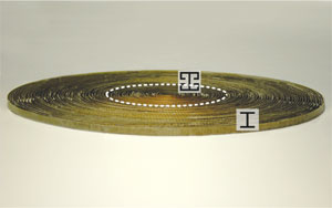 A 2D metamaterial omnidirectional absorber of microwave radiation, or 'black hole,' is made of concentric dielectric sheets containing different metal patterns, one type for the core and another for the outer shell.