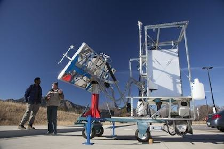 CU-Boulder postdoctoral researcher Tesfayohanes Yakob, left, and research engineer Dana Haushulz are shown here with a novel solar-thermal toilet developed by a team led by CU-Boulder Professor Karl Linden as part of the Bill & Melinda Gates Foundation's 'Reinvent the Toilet Challenge' to improve sanitation and hygiene in developing countries. (Image credit: University of Colorado Boulder)