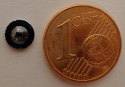 A Fresnel lens, 1 mm thick and with a diameter of a little less than 4 mm, is shown next to a Euro cent for comparison.