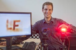 Matthias Hullin from the Institute of Computer Science II at the University of Bonn stands behind his around-the-corner time-of-flight imaging system.