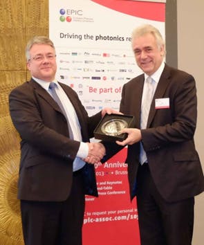 Nick Martin (left), CEO of Advanced Fibreoptic Engineering, receives the EPIC Phoenix Award 2013 from Drew Nelson (right), president of EPIC. The award was presented at EPIC&apos;s 10th anniversary celebration event on 13 December 2013 in Brussels.