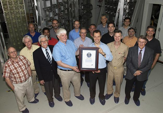 Researchers at the U.S. Naval Research Laboratory (NRL), Nike krypton fluoride laser facility, are the recipients of the Guinness World Records certificate for 'Highest Projectile Velocity.' Pictured from left to right: James (Jim) Weaver, Yefim Aglitskiy, Bruce Jenkins, Thomas (Tom) Mehlhorn, Jude Kessler, Dennis Brown, Stephen (Steve) Obenschain, Jason Bates, Victor Serlin, Steve Krafsig, Max Karasik, Lop-Yung Chan, Stephen (Steve) Terrell, Capt. Anthony Ferrari, Jaechul Oh, Sasha Velikovich, John Montgomery, and David Kehne. (Image credit: U.S. Naval Research Laboratory/Jamie Hartman)