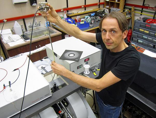 University of Utah physicist Christoph Boehme works in his laboratory on an apparatus used in a new study that brings physics a step closer to &ldquo;spintronic&rdquo; devices such as superfast computers, more compact data storage devices and more efficient organic LEDs or OLEDS than those used today for display screens in cell phones, computers and televisions.