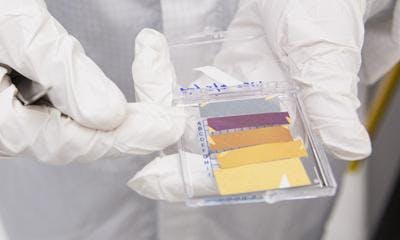 Harvard researcher Mikhail Kats demonstrates the fabrication process for ultrathin coatings that shine in vivid colors.