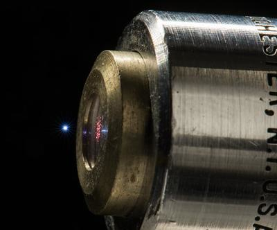 A microplasma is created by focusing intense laser pulses in ambient air with a microscope objective in the lab of University of Rochester Institute of Optics Ph.D. student Fabrizio Buccheri and his advisor, professor Xi-Cheng Zhang April 21, 2015. Besides visible light, the microplasma emits electromagnetic pulses at terahertz frequencies.