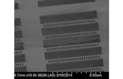 A scanning electron micrograph shows 1D diamond photonic-crystal cavities.