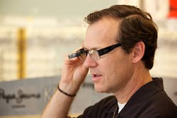 Vista, CA Chamber of Commerce CEO Bret Schanzebach tries out one of the wearable devices in Eyeglass World&rsquo;s new smart glass collection.