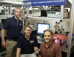 Professor Benjamin Eggleton, Thomas B&uuml;ttner and Moritz Merklein, researchers from CUDOS at the University of Sydney, are shown with the chalcogenide photonic chip that can manipulate optical nonlinearities.